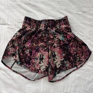 Lululemon high waisted workout shorts.  Fun bold black pink pattern size 4